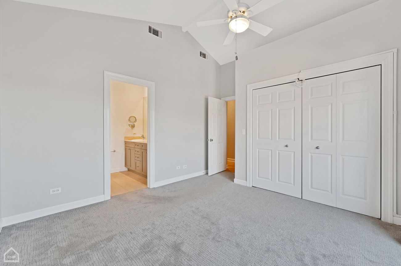 Damen Ave Condo — primary bedroom, second angle with ensuite and closet