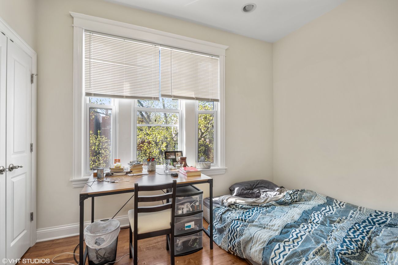 The Evergreen — bedroom with hardwood floors
