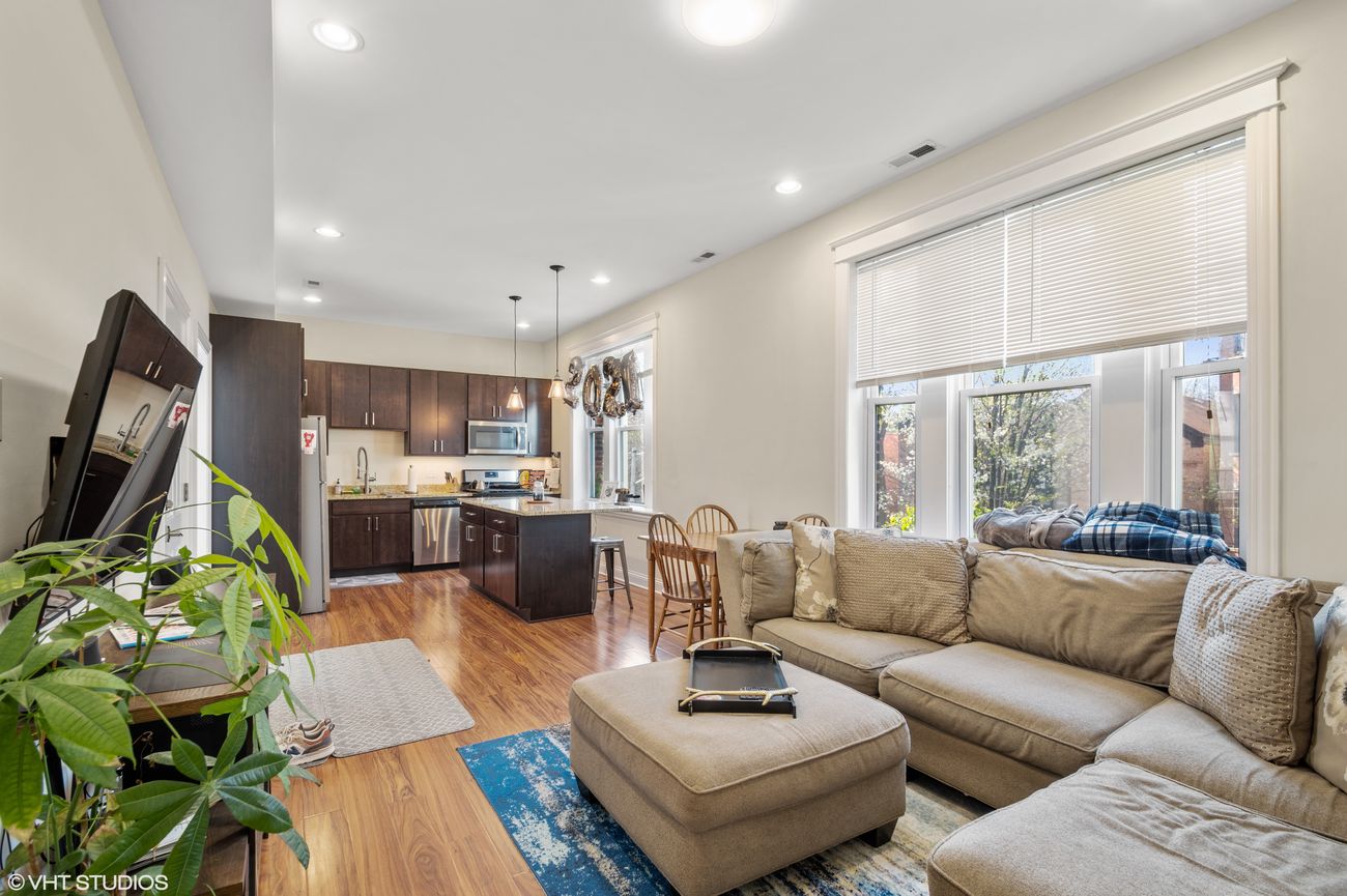 The Evergreen — open living and kitchen area, wide view