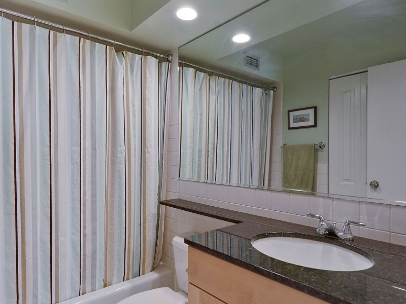 Sheridan Tower Condo — bathroom with granite vanity