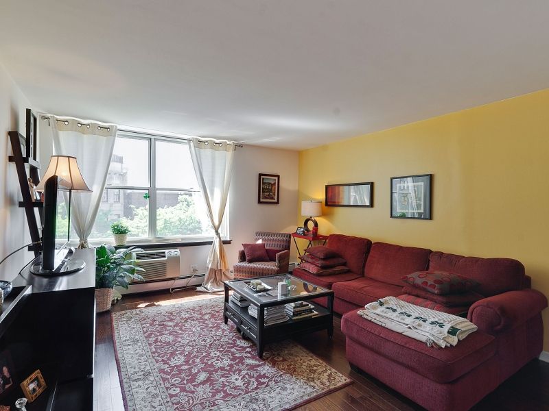 Sheridan Tower Condo — living room with hardwood floors