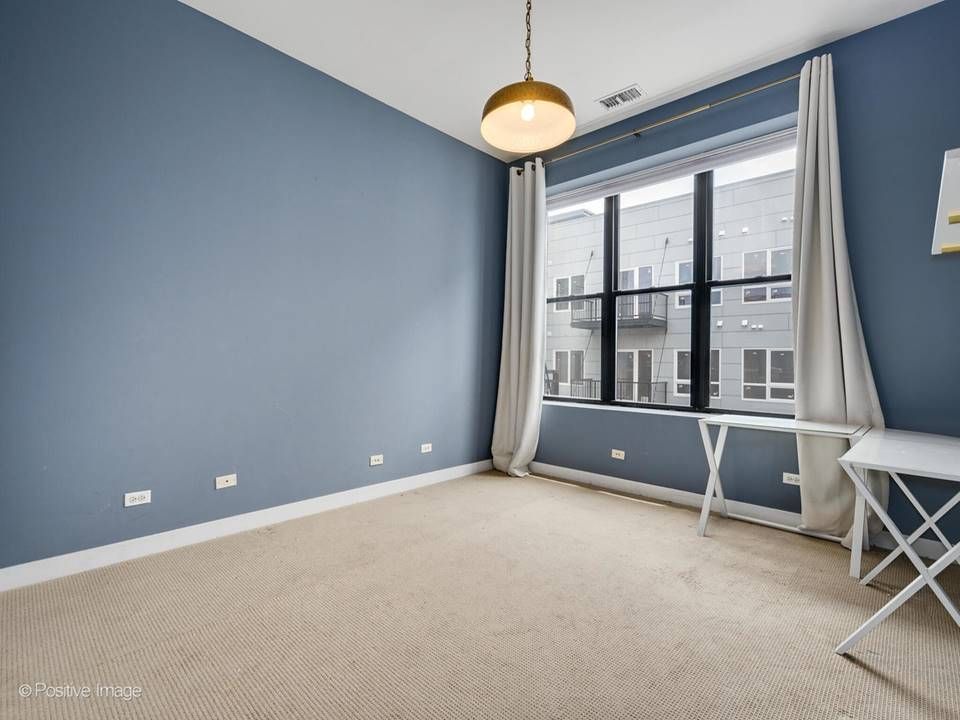 The South Leavitt — bedroom with blue accent wall