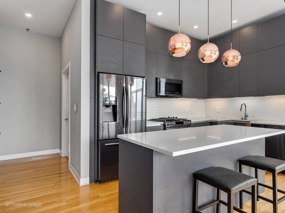 The South Leavitt — kitchen with stainless refrigerator and quartz island