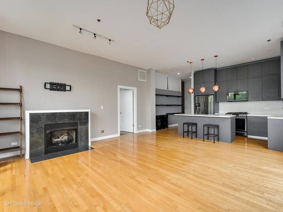 The South Leavitt — living room fireplace open to the kitchen