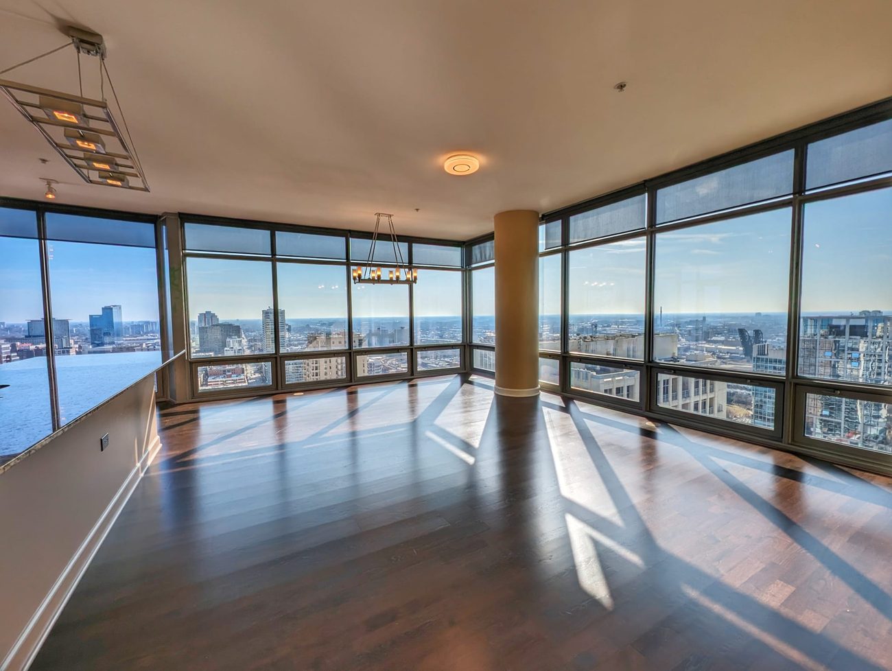 South Loop Penthouse — corner living room with floor-to-ceiling windows