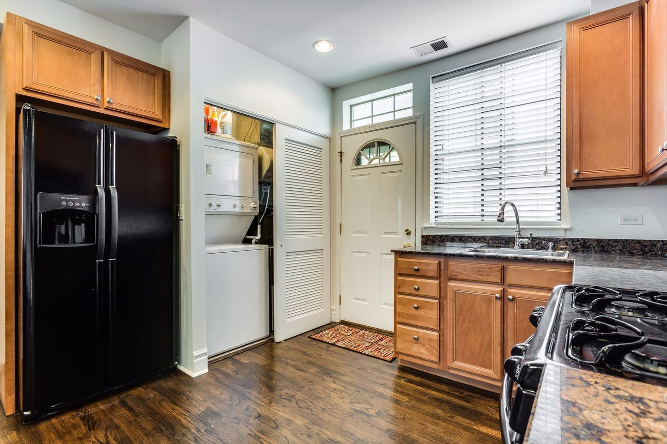 Troy St — kitchen with black appliances and granite counters
