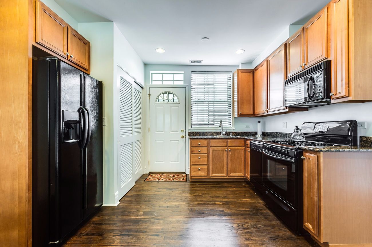 Troy St — open view from living room toward the kitchen and entry
