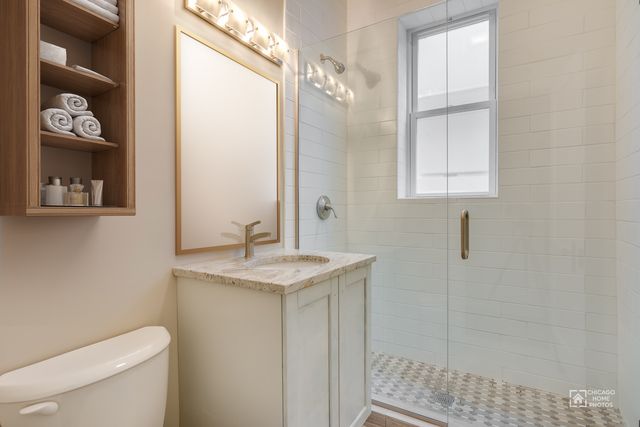 Ukrainian Village 6 — unit bathroom with glass-enclosed shower