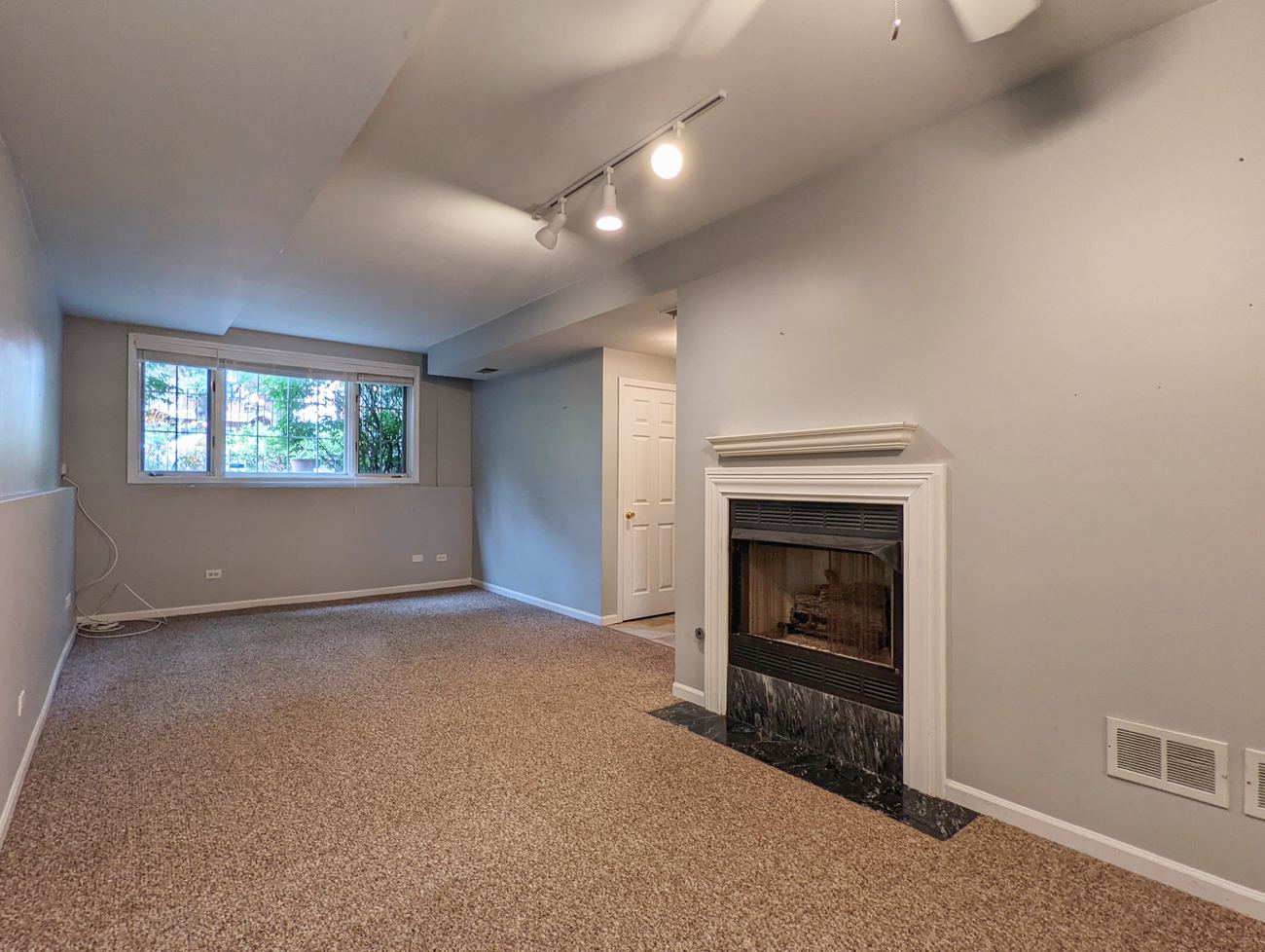 Walton Street Fourplex — unit living room with fireplace