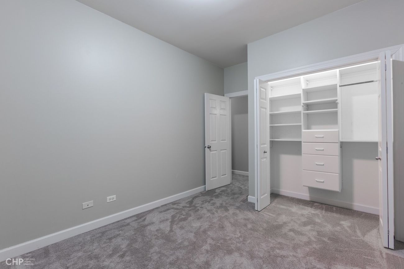 West Lakeview Duplex — lower-level bedroom with closet