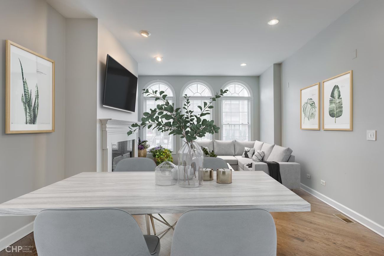 West Lakeview Duplex — living room with fireplace and arched windows