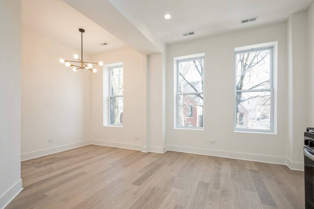 Wicker Park 3 Flat — Unit 2 living/dining area with large windows