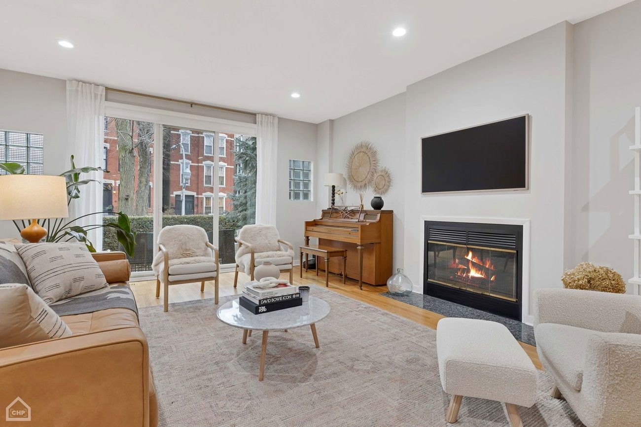 Wicker Park Gem — living room fireplace with wall-mounted TV